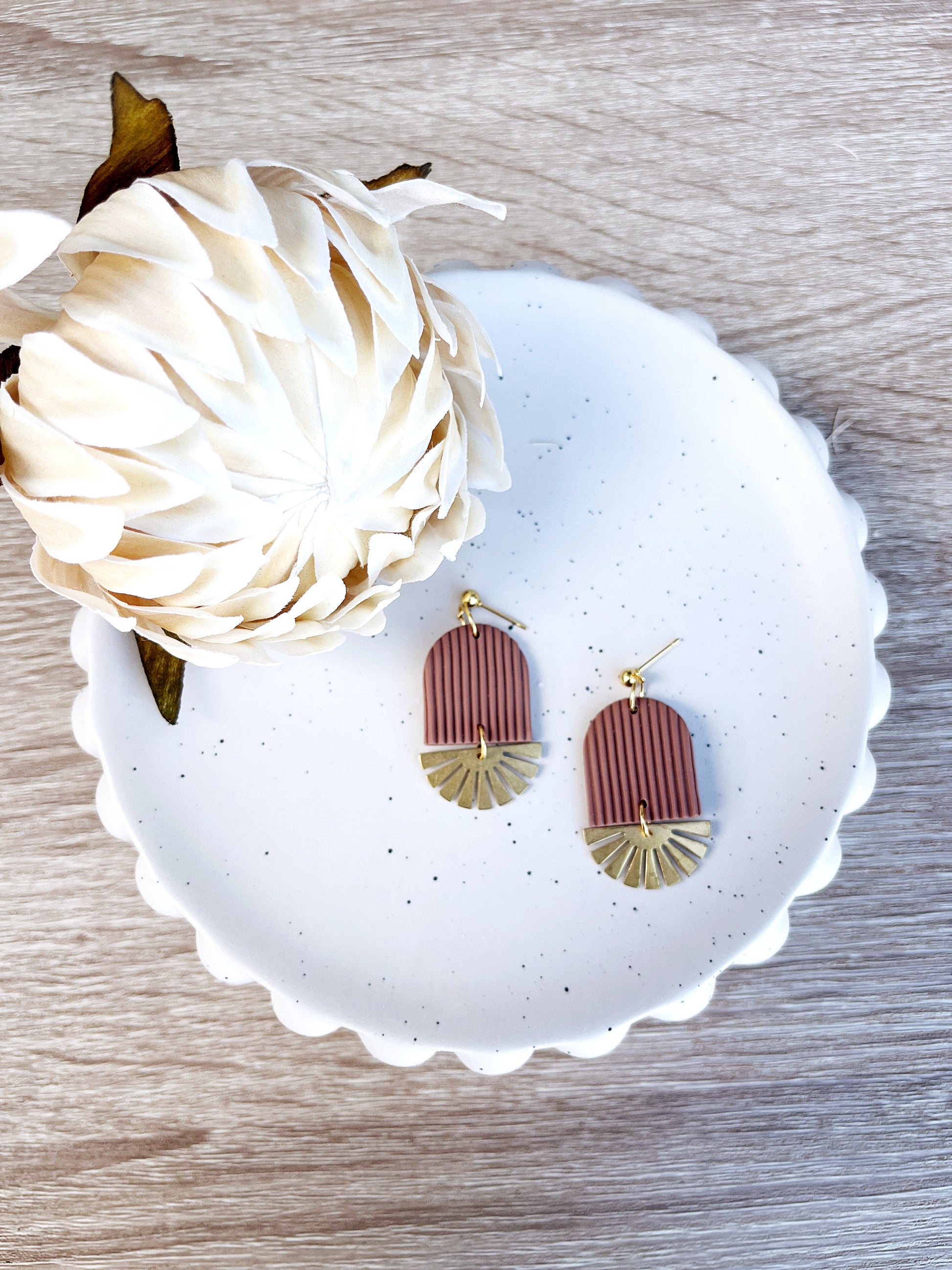 Gold and mocha mousse arch earring with brass sun
