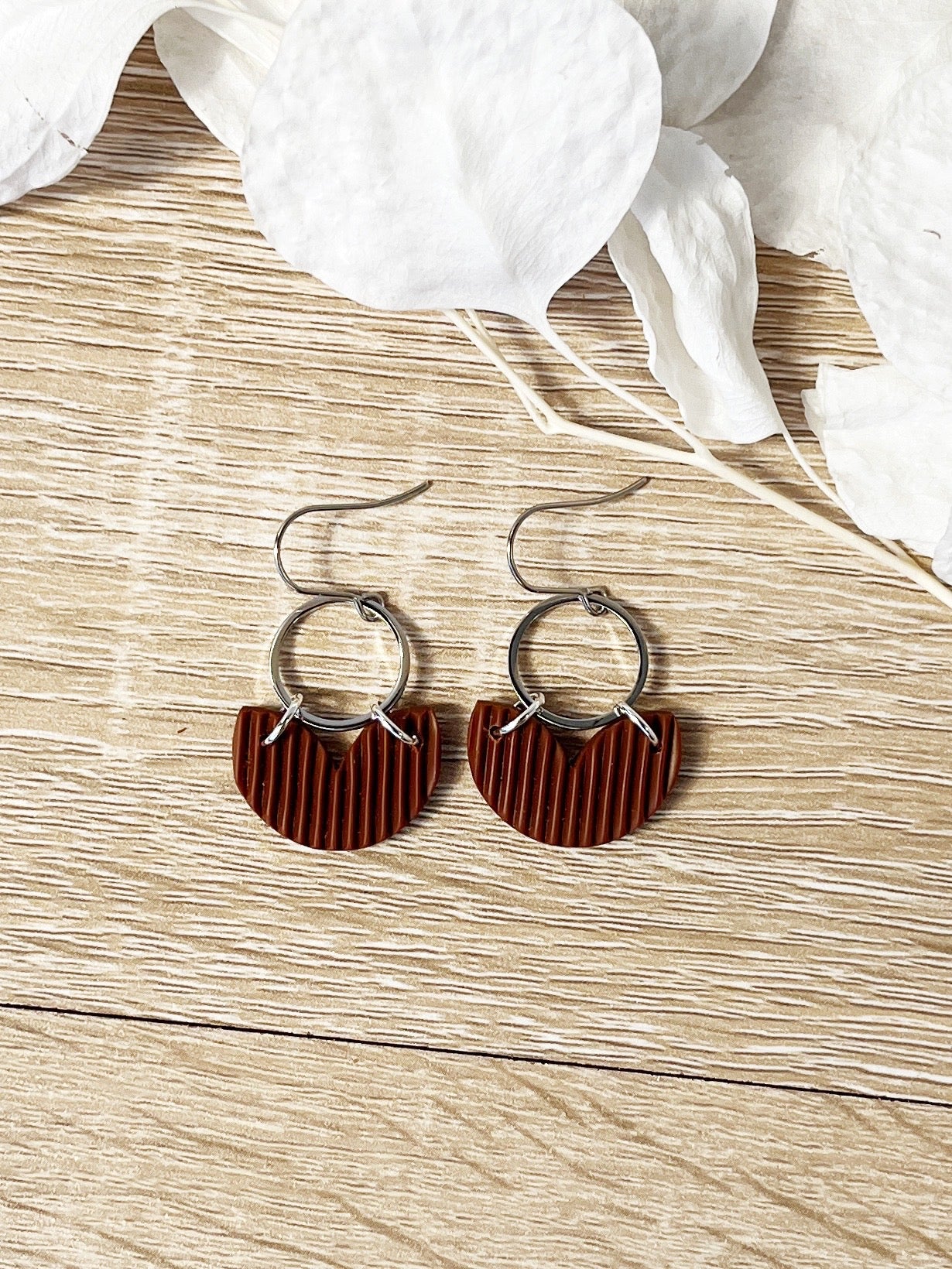 Silver hook earring with chocolate brown heart shape