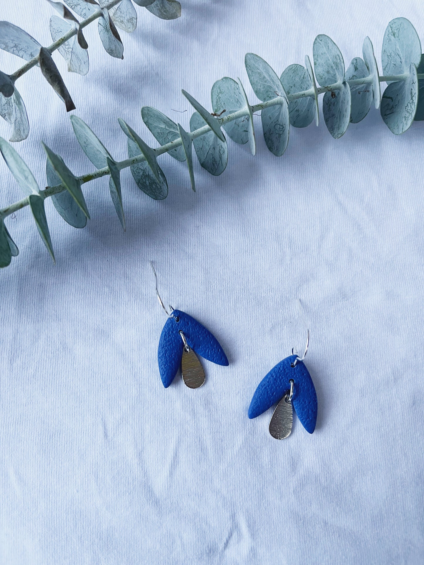 Blue petal look clay earring with silver hook