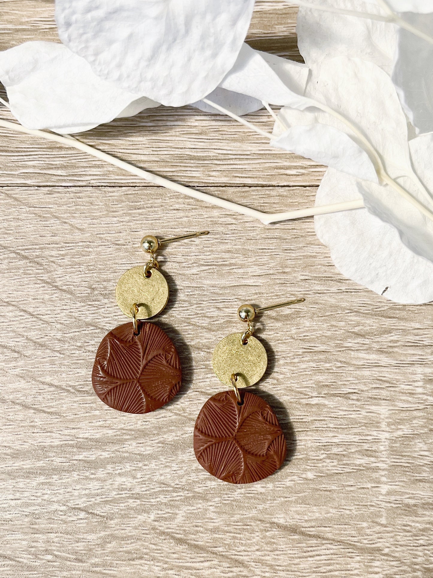 Gold stud earring with chocolate brown textured organic circle