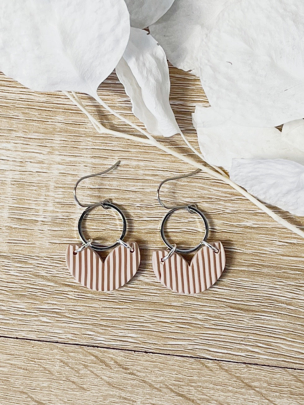 Silver hook earring with beige heart shape