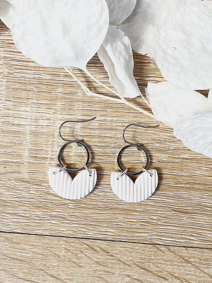 Silver hook earring with white heart shape
