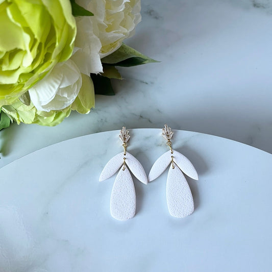 White w/gold statement stud